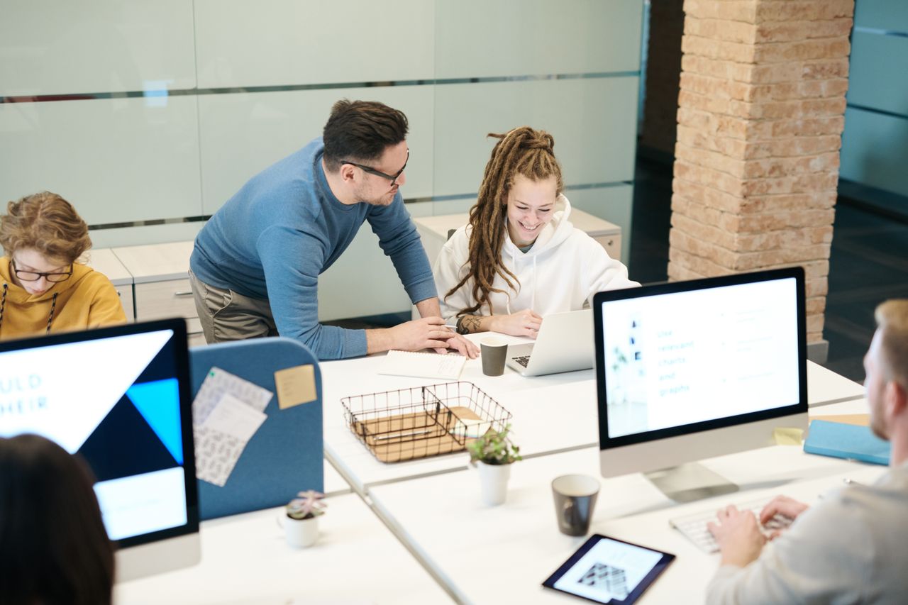 A diverse team of colleagues working together in a modern office environment.